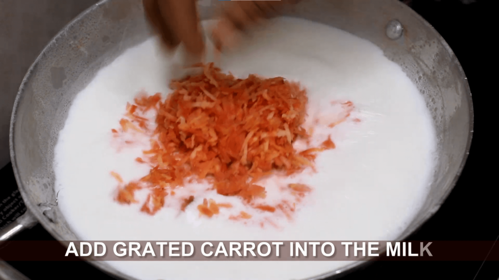 Gajar ka halwa - add grated carrot to the boiling milk