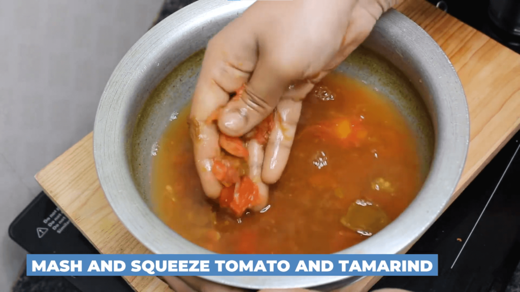 Tomato Rasam Without Dal - Mash and Squeeze the tomatoes and tamarind